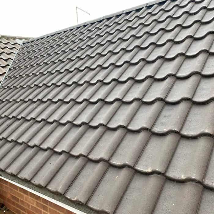A house with a tiled roof was built by contractors.