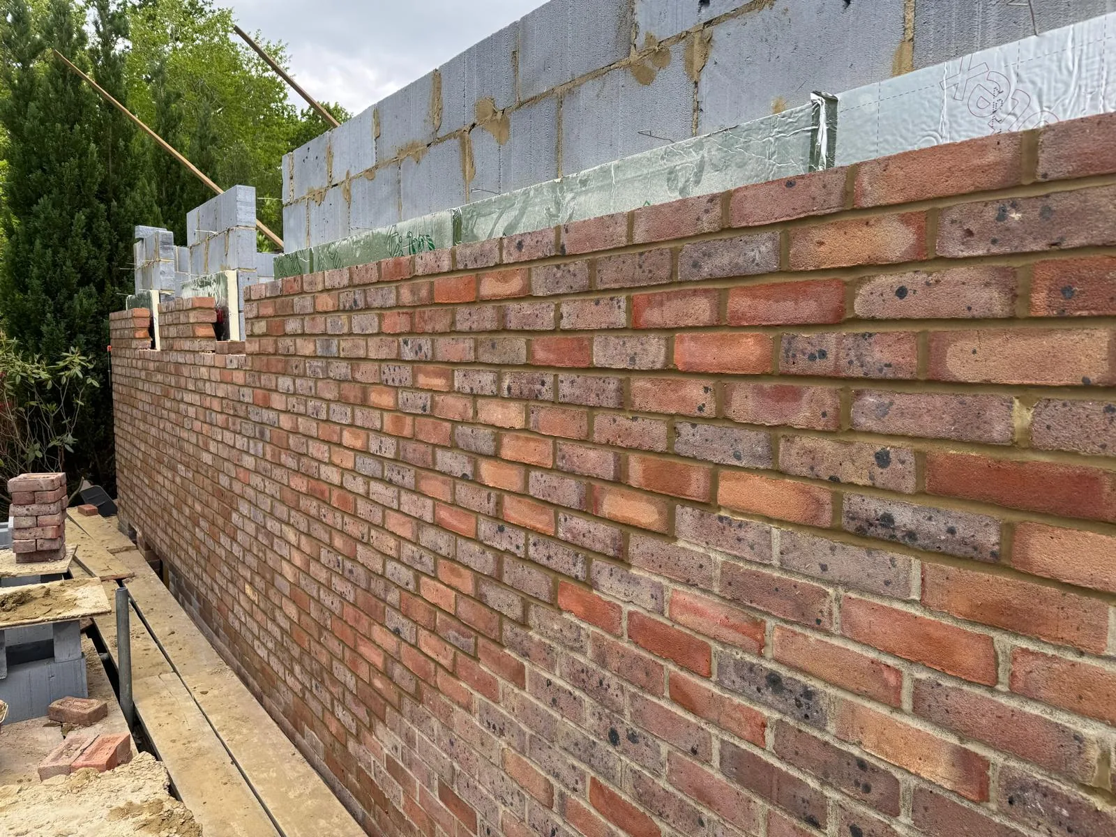 Facing brickwork and insulated cavity-wall construction by A Jones Contractors in Surrey