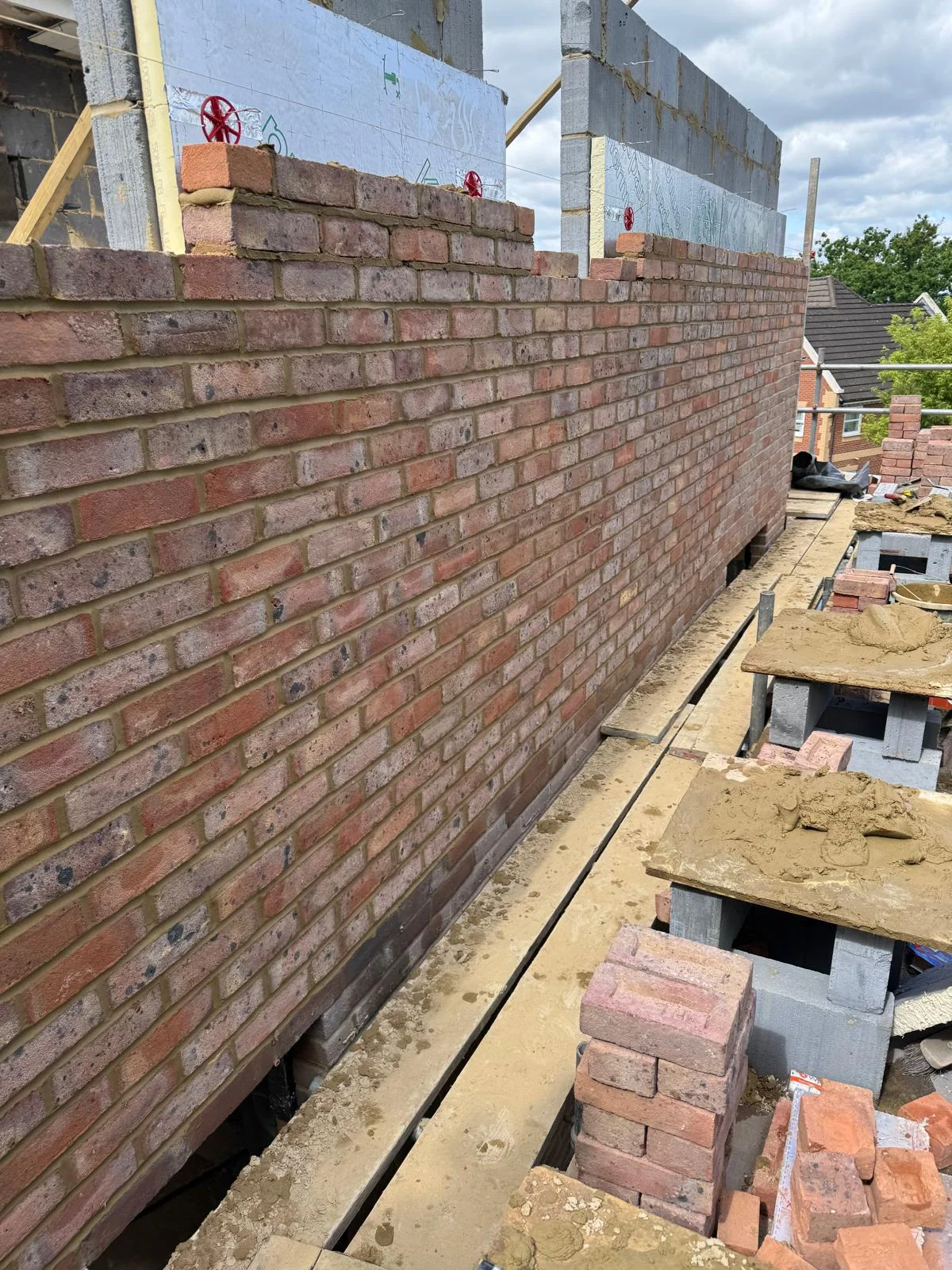 Detailed cavity wall brickwork and insulation installed by A Jones Contractors