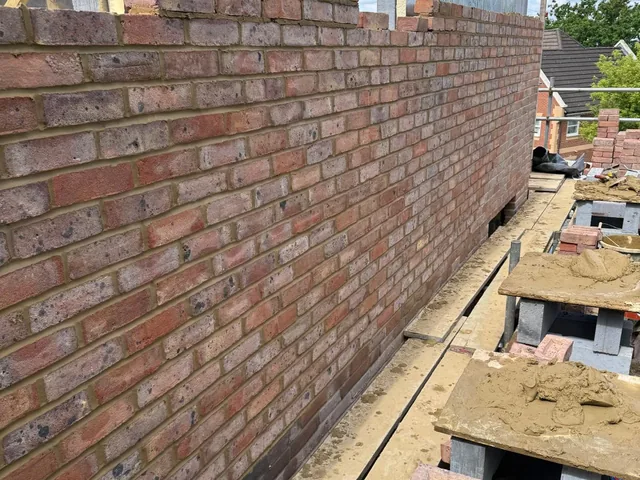 Detailed cavity wall brickwork and insulation installed by A Jones Contractors