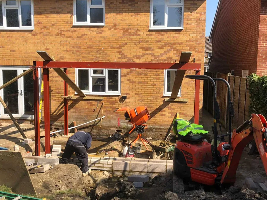 Structural steel installation with excavator support by A Jones Contractors